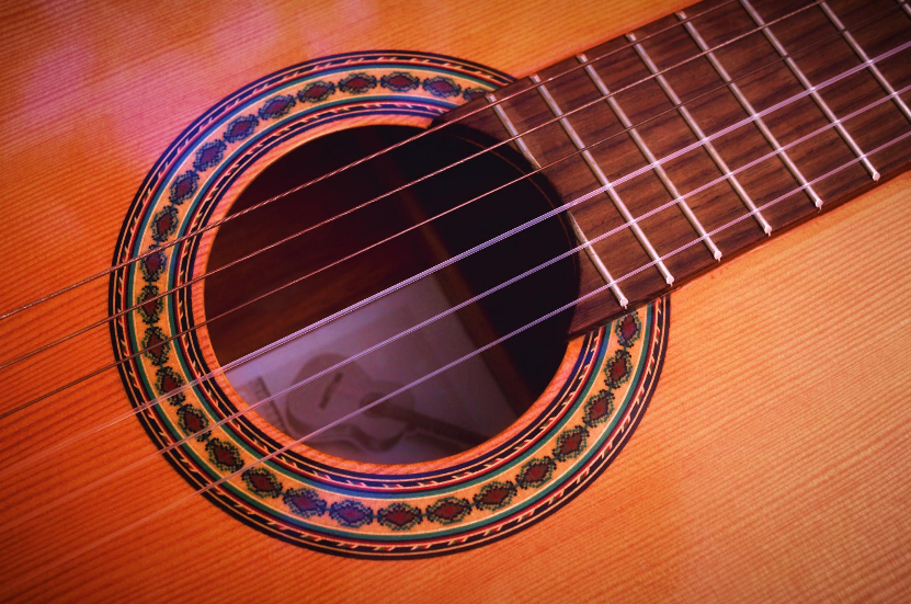 Classical Guitar Sound Hole Photo by Adri Tormo on Unsplash