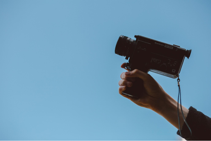 Hand Holding a Video Camera  Photo by Thomas William on Unsplash