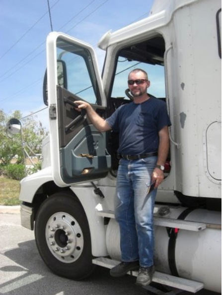 Charles Van Deursen Standing on the Catwalk Platform of a Tractor Trailer, by Dianne Hutchins. www.InTuneWithYou.com