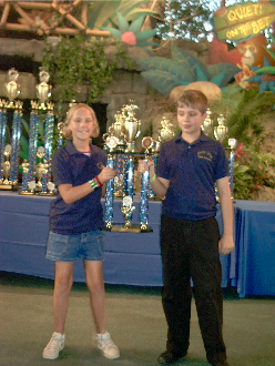 Two South Olive Elementary Tiger Chorus Singers Holding a "Superior" Rating Trophy, InTuneWithYou.com