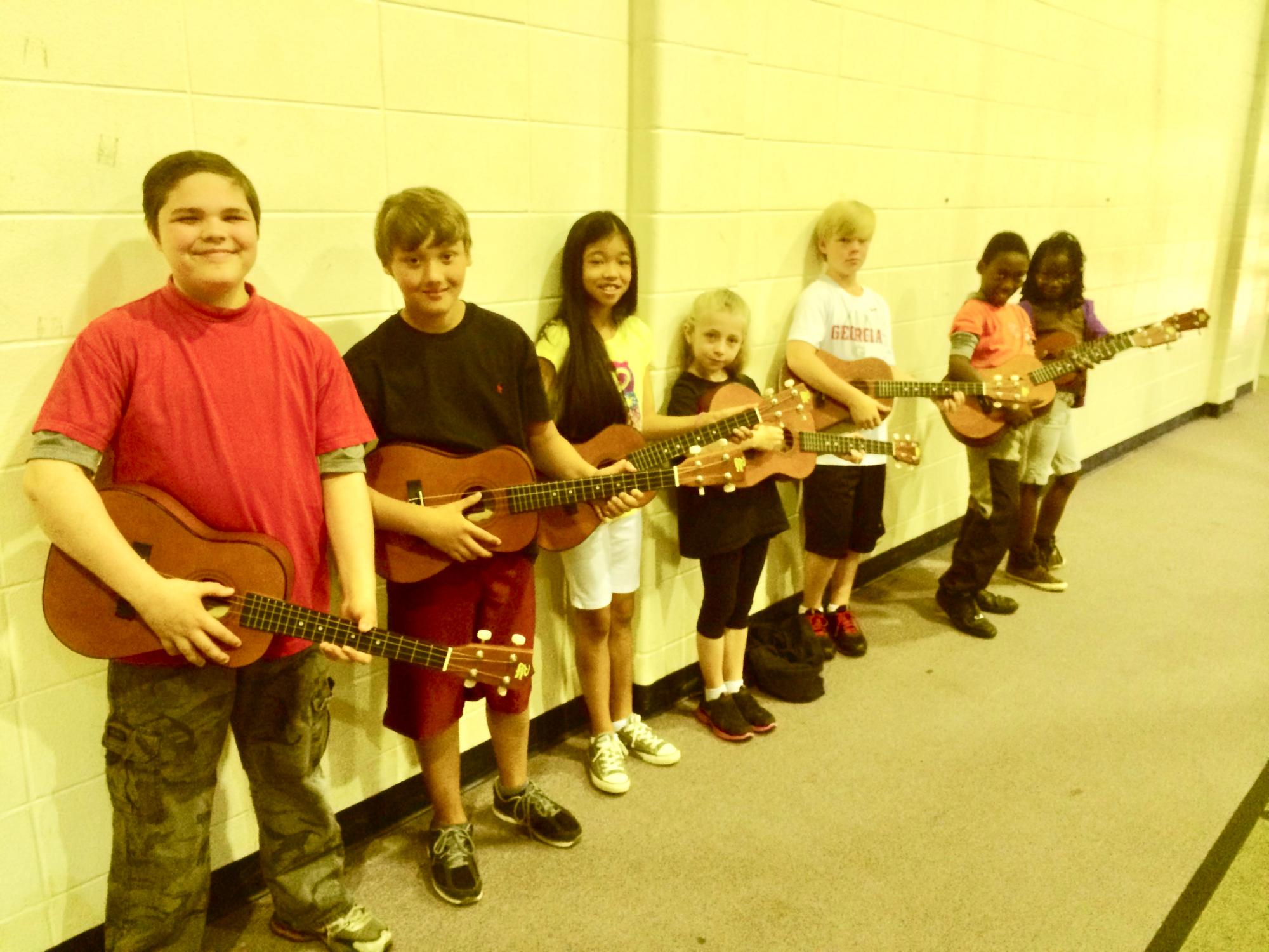 Baritone Ukulele Students Holding Their Instruments by Charles Van Deursen